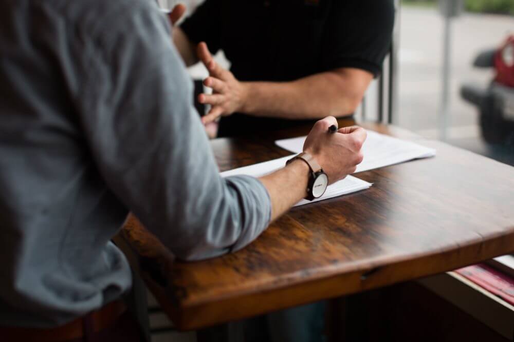 Two people with papers