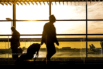 Man with suitcase at an airport