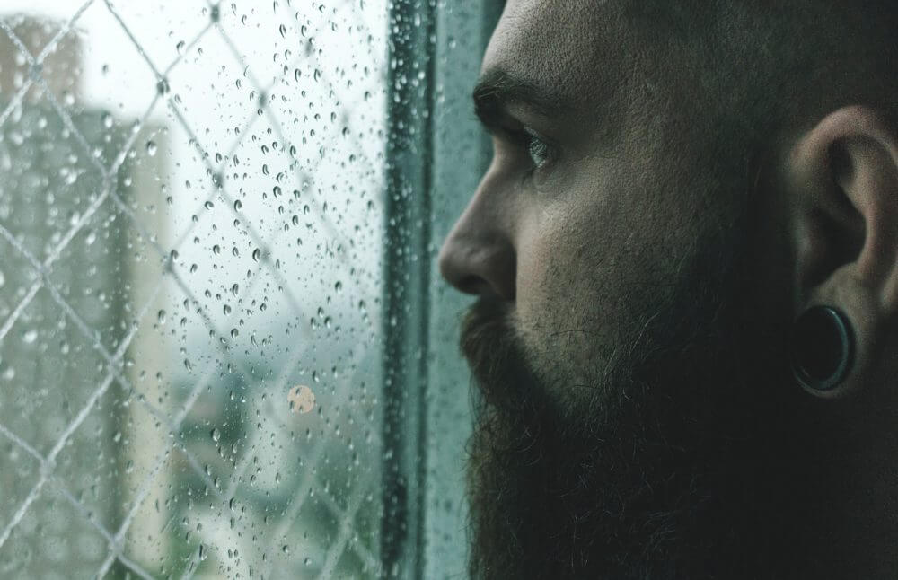 a man looking out of a window