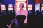 woman gambling on a slot machine