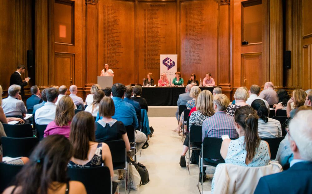 A picture from our report launch event, showing our Head of Research and Policy presenting the new research to the audience