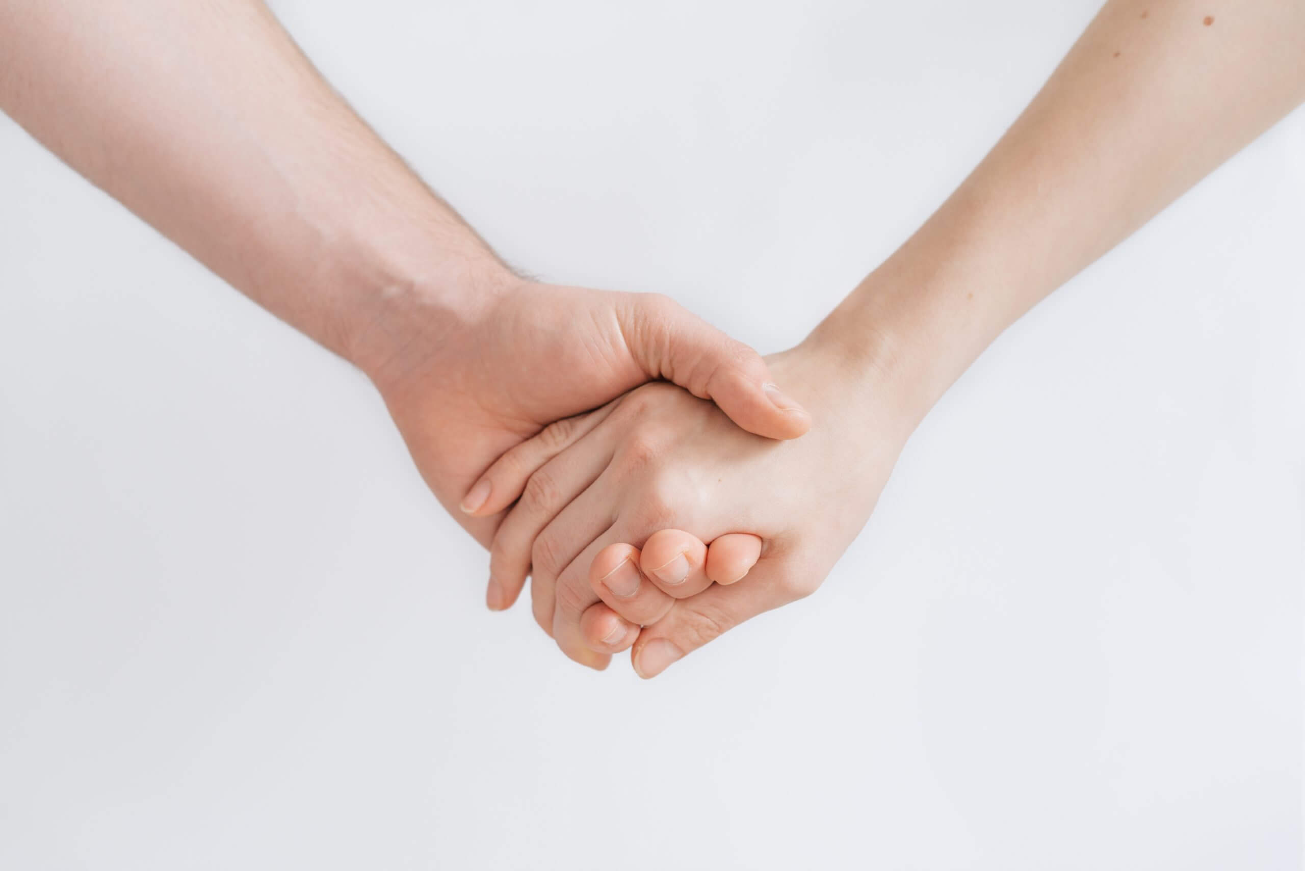 people holding hands photography