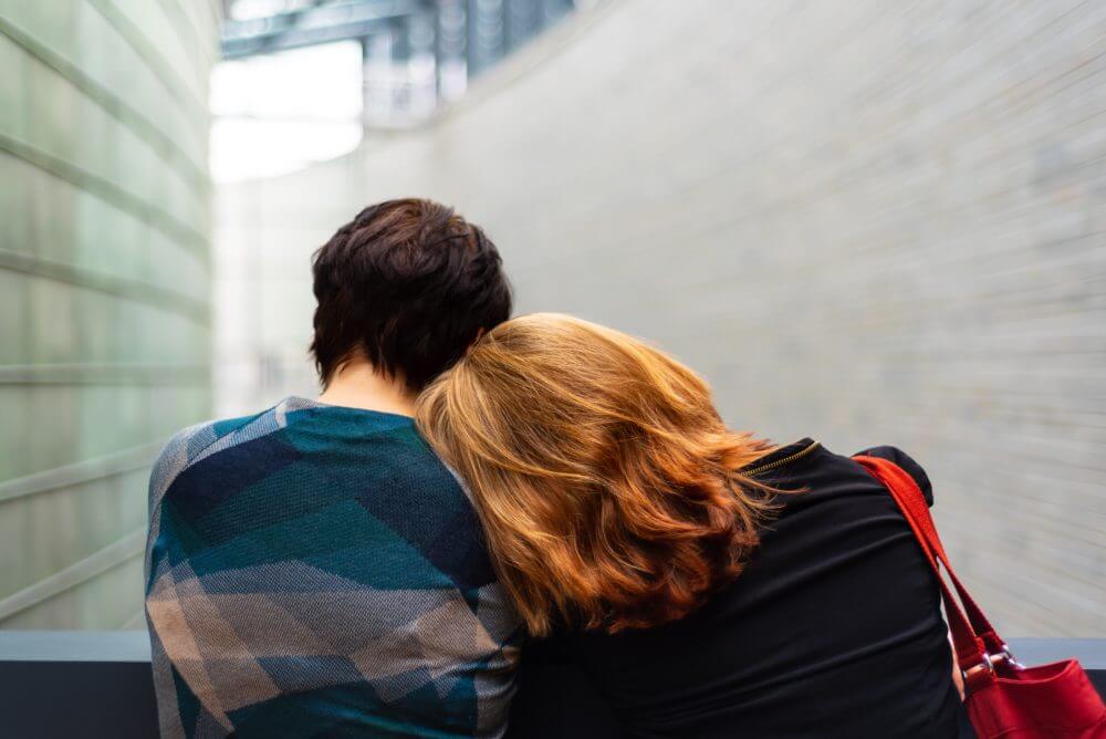 picture of two people sitting on a bench together