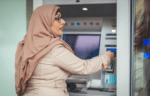 Person using an ATM machine