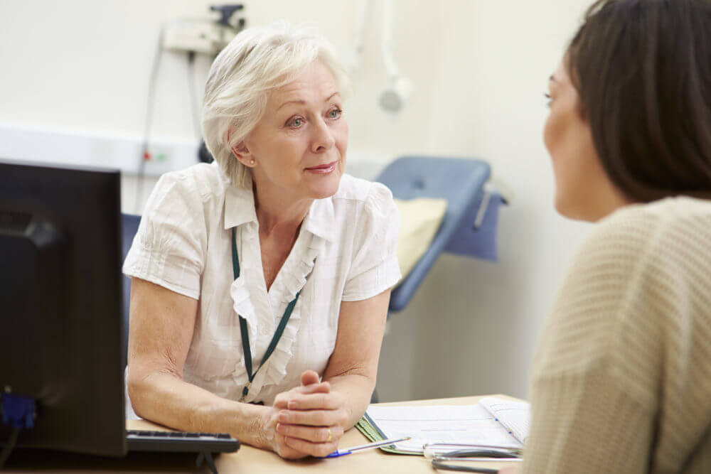 Gp talking to a patient