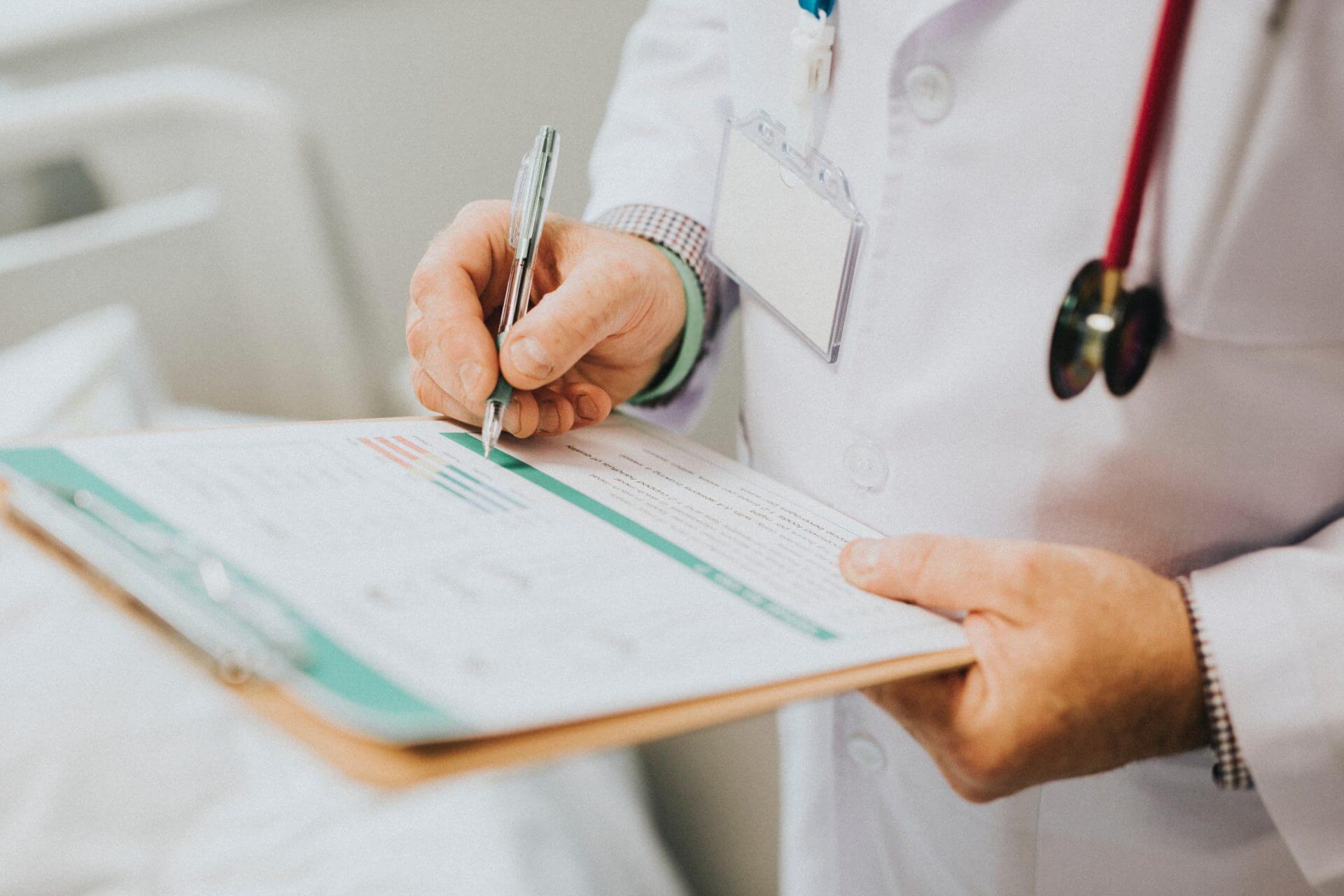 Doctor holding a clipboard and pen