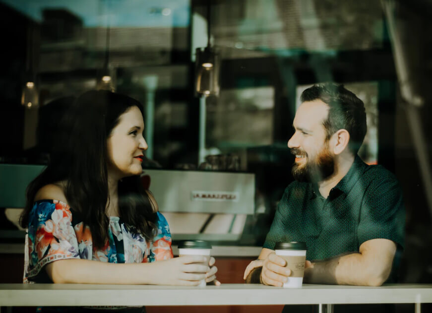 two people in a cafe