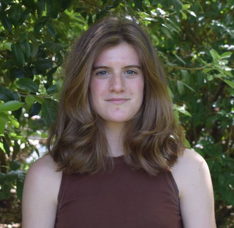 Photo of Rachel Fergusson standing outside in front of greenery