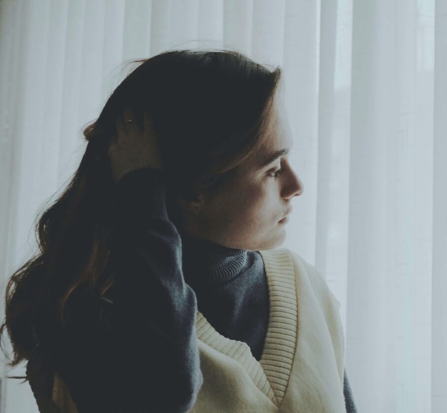 Woman looking out of wi