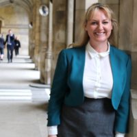 Dr Lisa Cameron MP standing in corridor