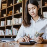 Woman calculating money