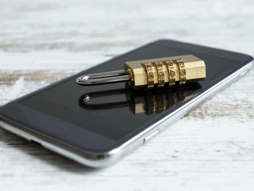A mobile phone with a small padlock placed upon the screen.