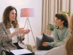 Two people talking in support services context.