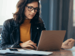 Woman looking at laptop screen