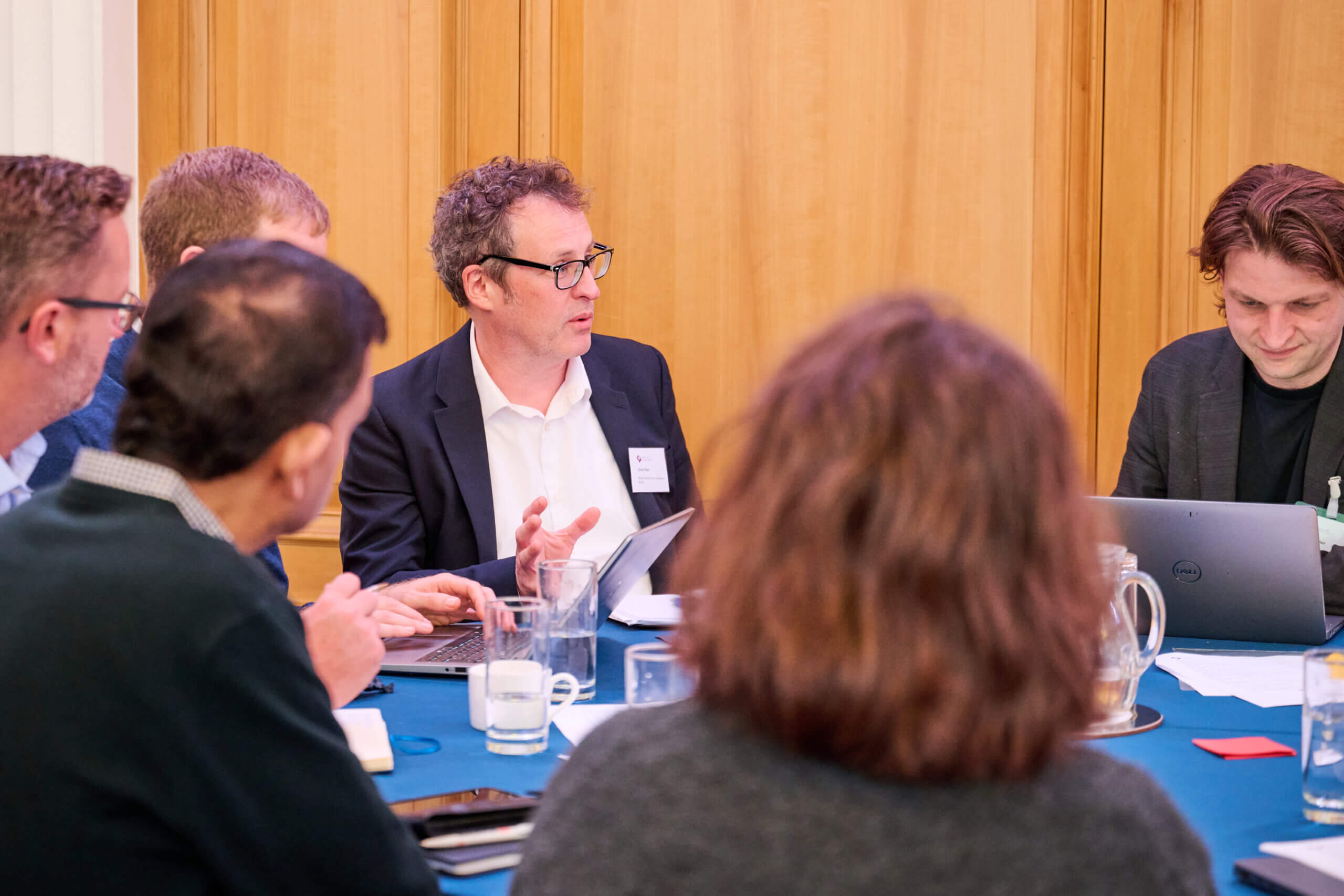 Attendees in discussion at a table at our data sharing event