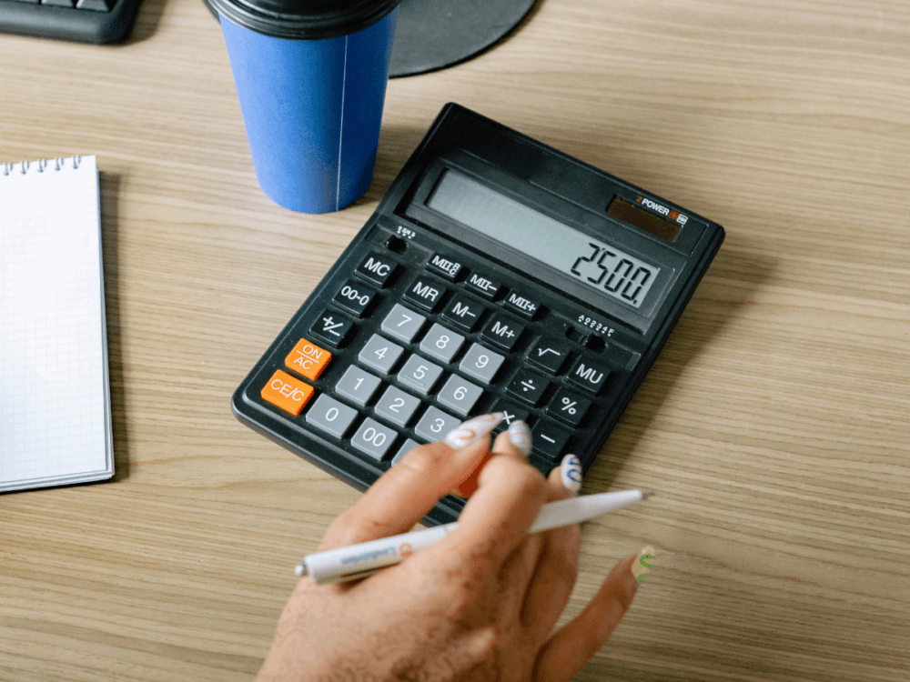 A hand using a calculator.
