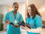 Two medical professionals in a healthcare setting, representing a neighbourhood health centre.